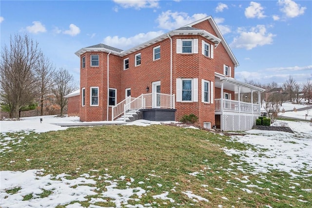 view of snowy exterior with central AC unit, a pergola, and a lawn