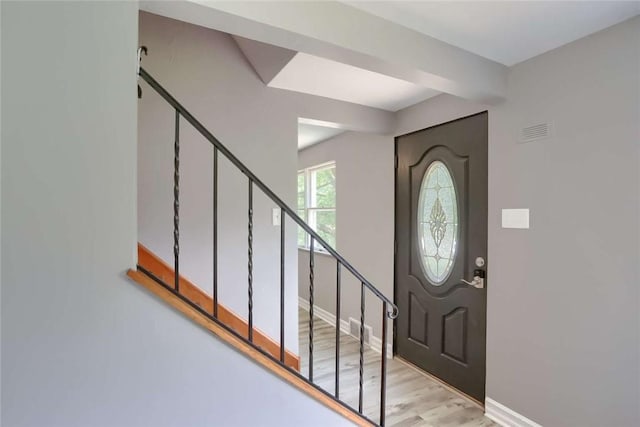 foyer entrance with light hardwood / wood-style flooring