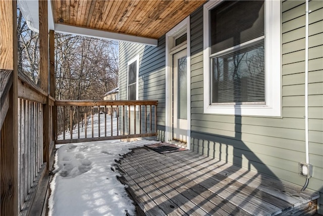 view of snow covered deck