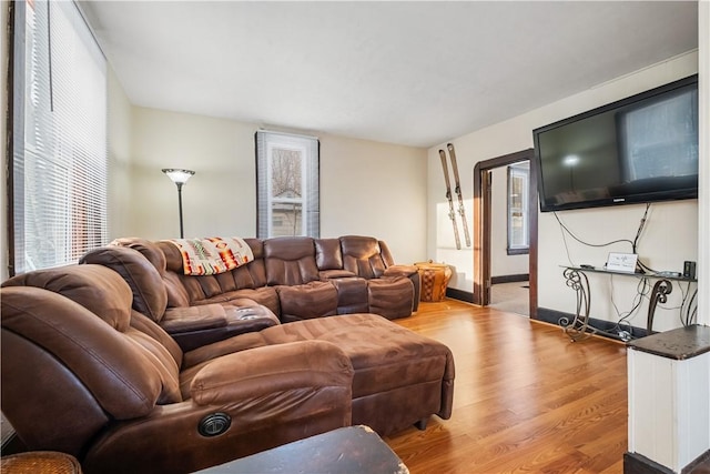 living room with light hardwood / wood-style flooring