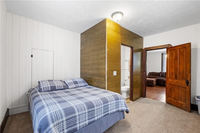 carpeted bedroom with ensuite bathroom