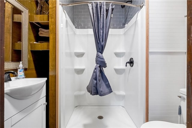 bathroom with vanity and walk in shower