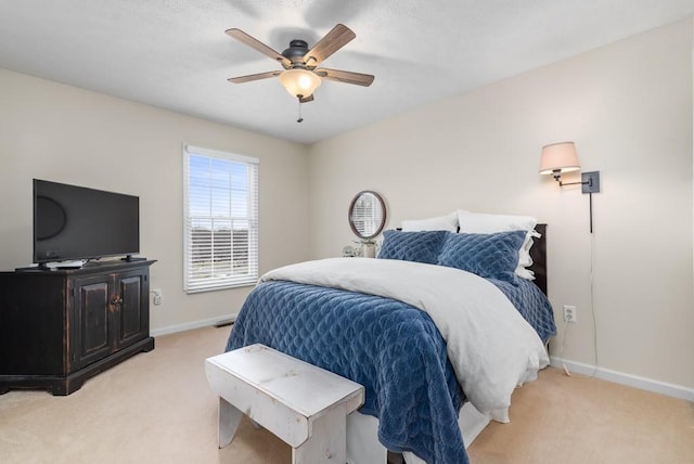 bedroom featuring light colored carpet and ceiling fan