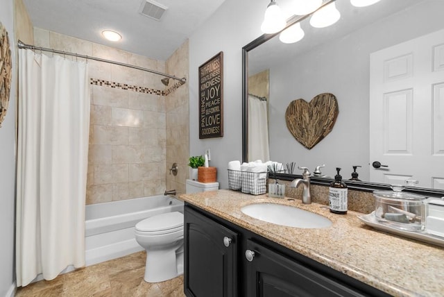 full bathroom featuring vanity, shower / bath combo with shower curtain, and toilet