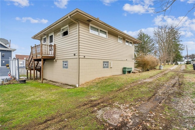 view of property exterior with a lawn