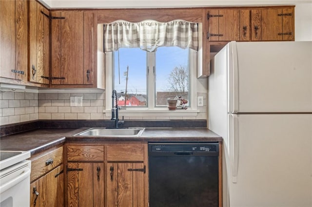 kitchen with tasteful backsplash, dishwasher, white fridge, and sink