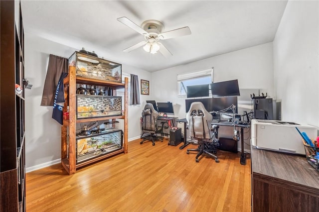 office with wood-type flooring and ceiling fan