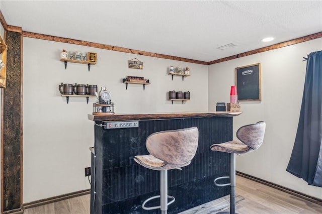 bar featuring hardwood / wood-style floors