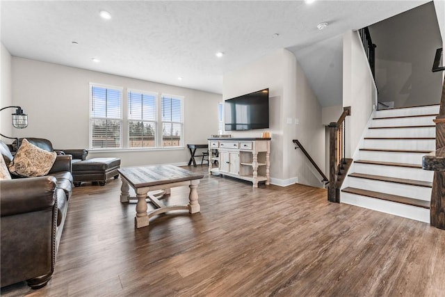 living room featuring hardwood / wood-style floors and a textured ceiling