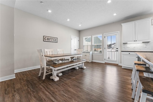 dining space featuring dark hardwood / wood-style flooring