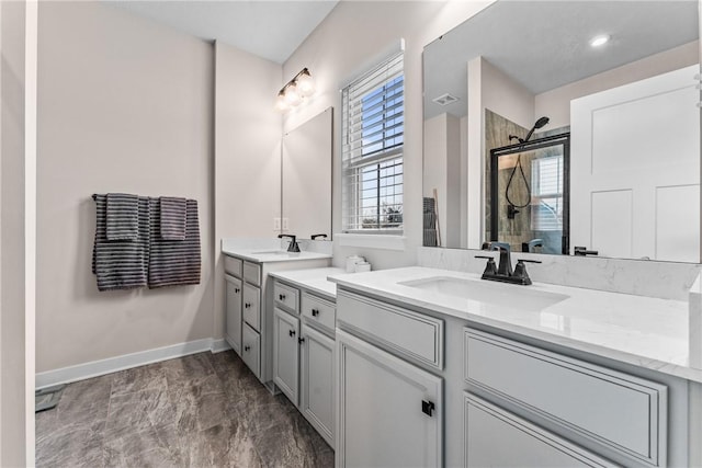 bathroom featuring vanity and an enclosed shower