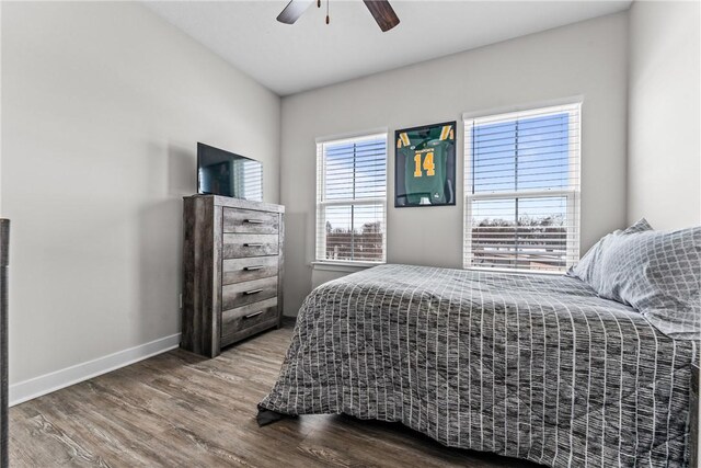 bedroom featuring hardwood / wood-style flooring and ceiling fan