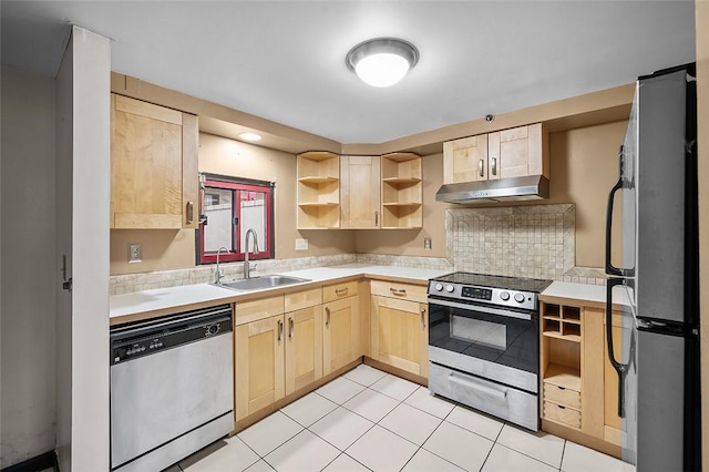 kitchen with light tile patterned flooring, stainless steel appliances, light brown cabinetry, and sink