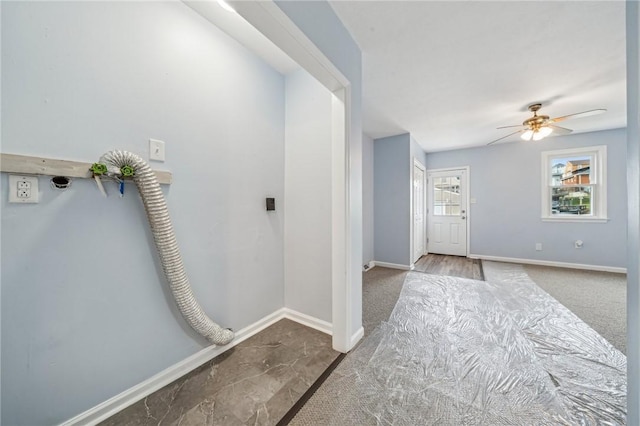 foyer entrance with ceiling fan