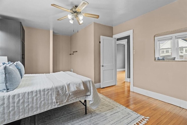 bedroom featuring hardwood / wood-style floors and ceiling fan