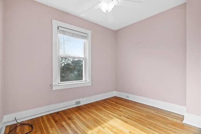 unfurnished room with ceiling fan and light wood-type flooring