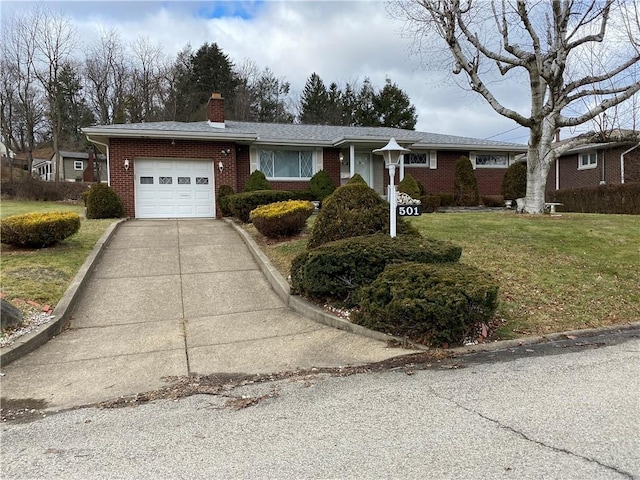 single story home with a garage and a front lawn