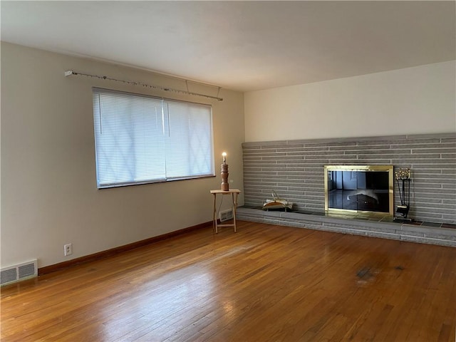 unfurnished living room featuring hardwood / wood-style flooring