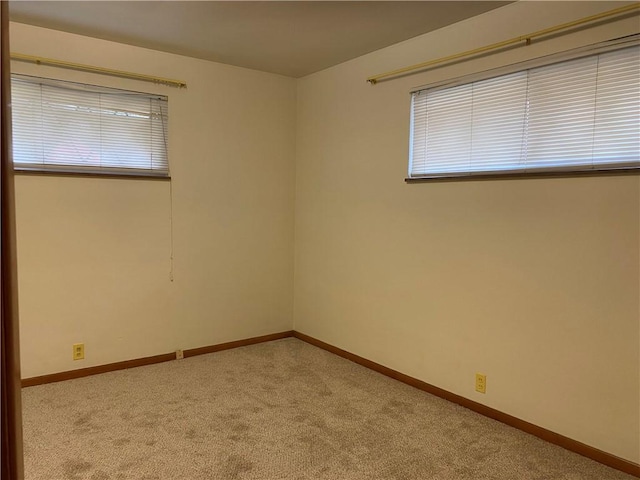 empty room with light colored carpet