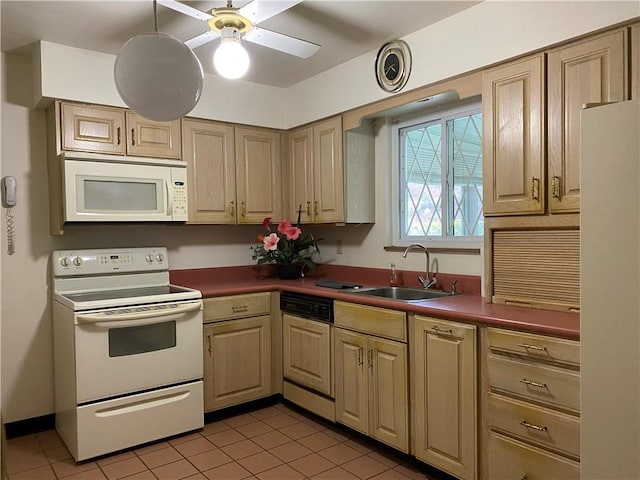 kitchen with sink, white appliances, light tile patterned floors, and ceiling fan