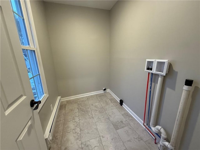 laundry room with baseboard heating and washer hookup