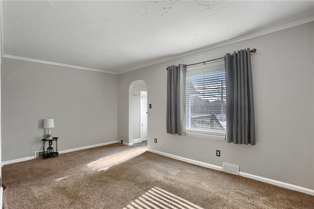 carpeted empty room featuring ornamental molding