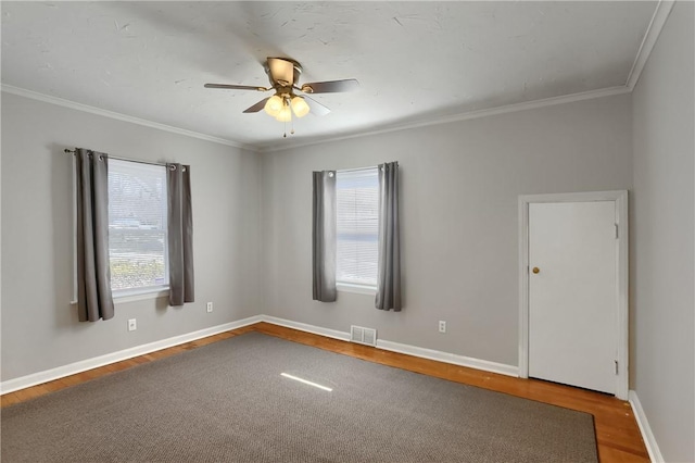 spare room with ornamental molding, hardwood / wood-style floors, and ceiling fan