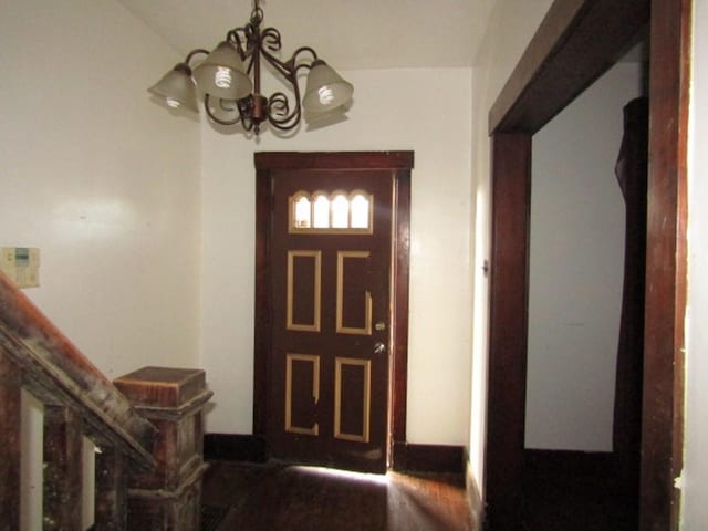 foyer with an inviting chandelier