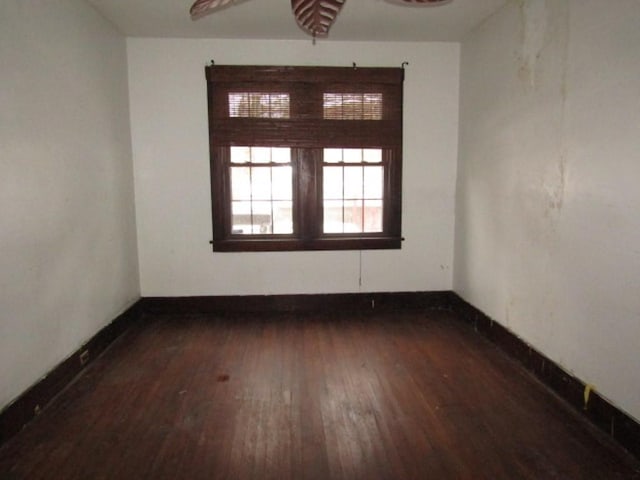 spare room featuring dark hardwood / wood-style flooring