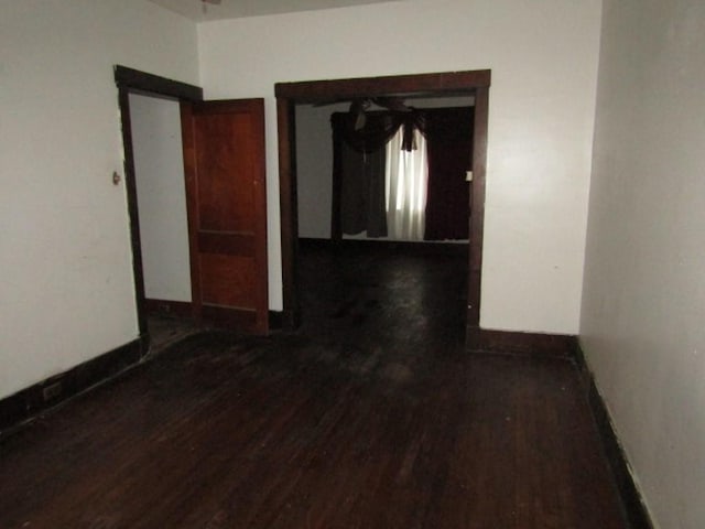 hall with dark hardwood / wood-style flooring