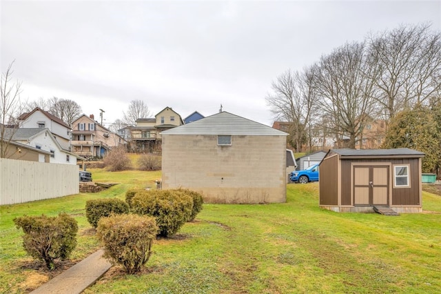 view of yard with a storage unit