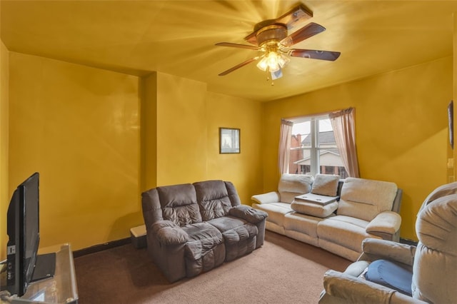 living room with ceiling fan and carpet flooring