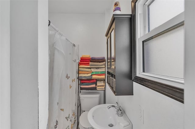 bathroom with toilet and sink