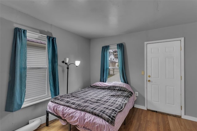 bedroom with hardwood / wood-style flooring