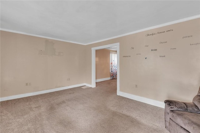 spare room with light carpet and ornamental molding