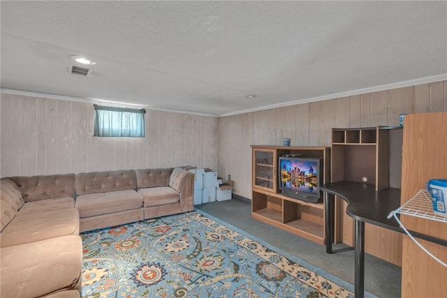 carpeted living room featuring crown molding and a textured ceiling