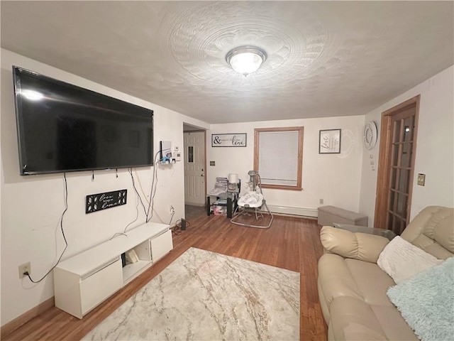 living room featuring hardwood / wood-style floors and a textured ceiling