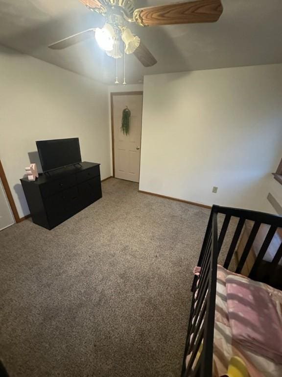 interior space featuring carpet and ceiling fan