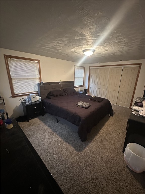 bedroom featuring a closet and carpet