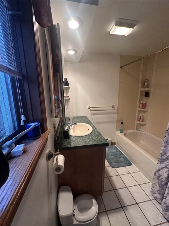 full bathroom featuring tile patterned flooring, vanity, bathtub / shower combination, and toilet