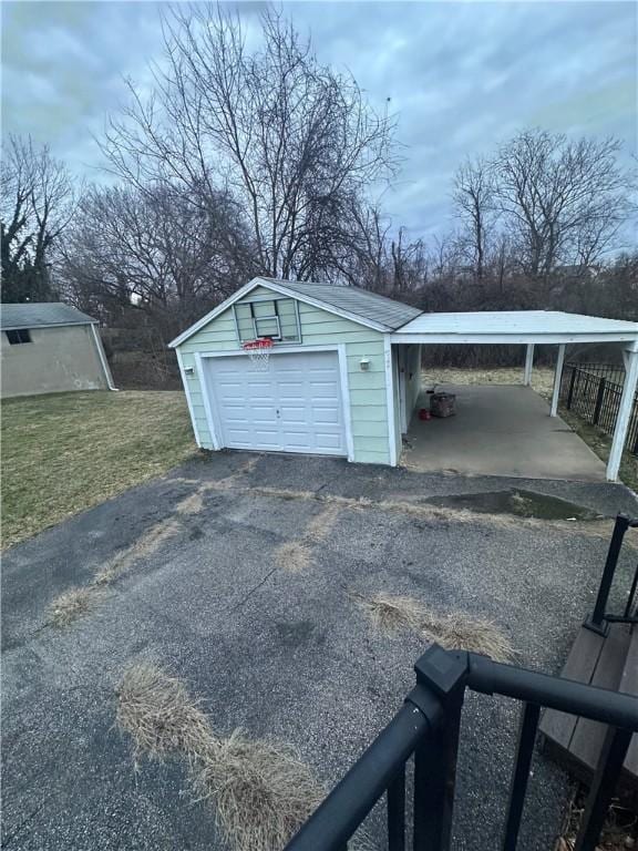 garage featuring a carport