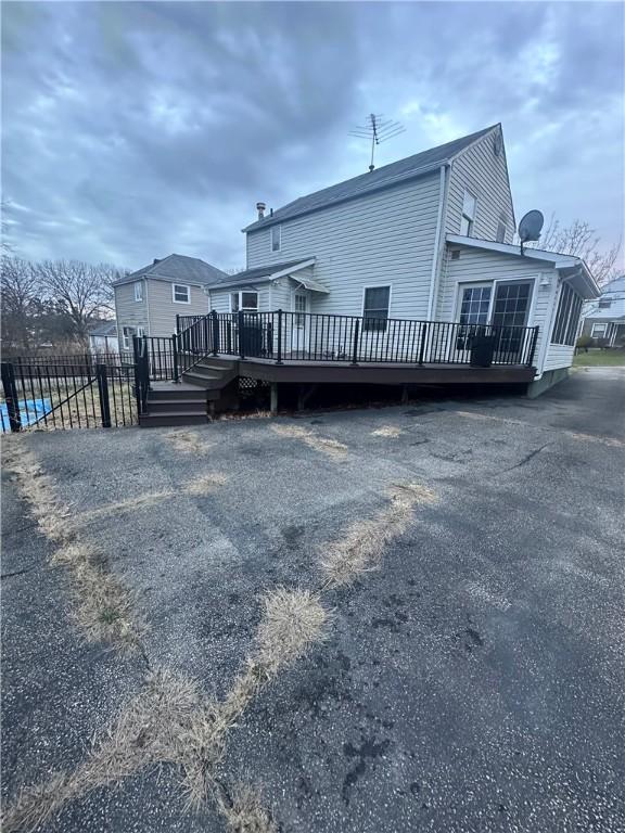 back of property with a deck