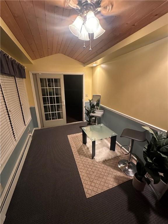 carpeted home office featuring vaulted ceiling, ceiling fan, wooden ceiling, and baseboard heating