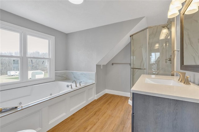 bathroom with vanity, wood-type flooring, and separate shower and tub