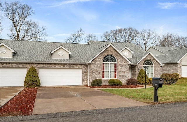 view of front facade featuring a garage and a front lawn