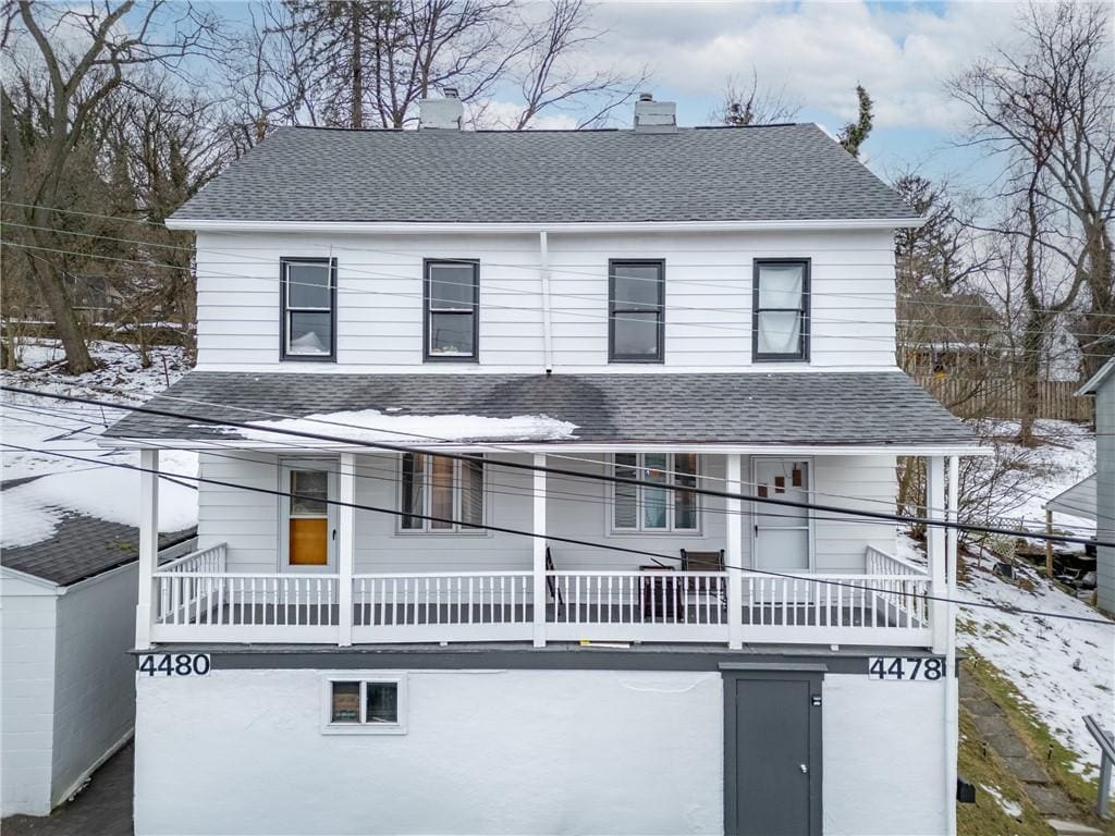 view of front of home with a balcony