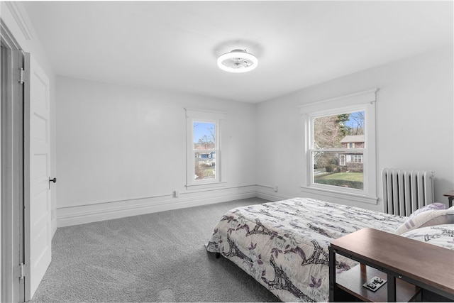 bedroom featuring radiator heating unit and carpet floors