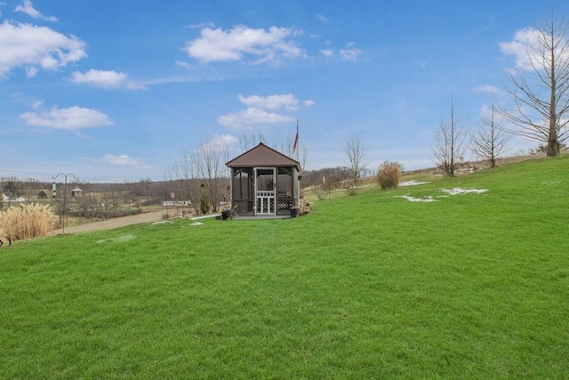 view of yard featuring a sunroom