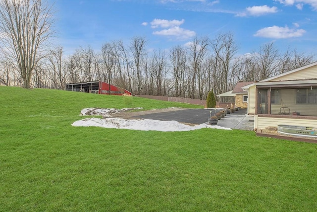 view of yard with a sunroom