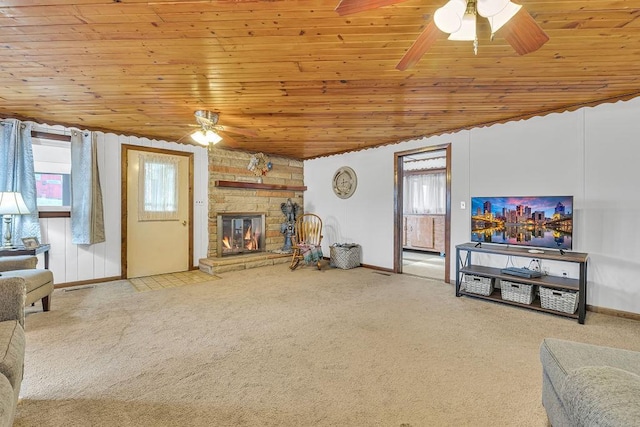 carpeted living room featuring ceiling fan, plenty of natural light, and wooden ceiling